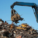 Scrap metal trash for recycling. Claw Grabber Crane
